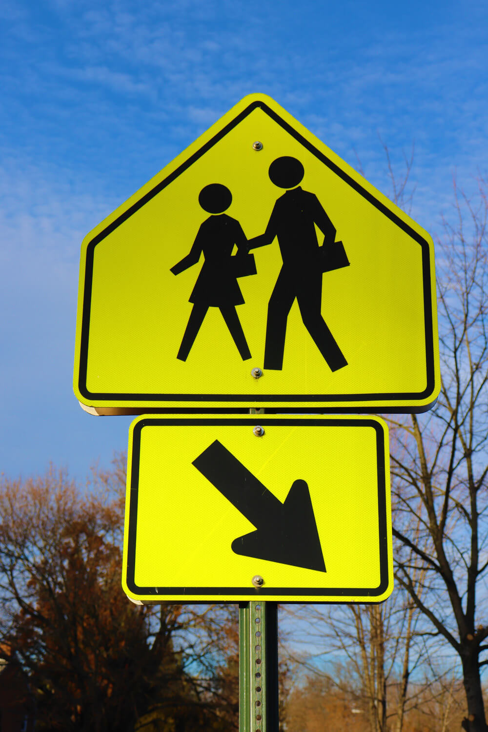 Pedestrian crossing road traffic sign showing a person on a zebra